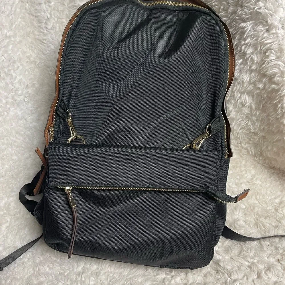 Tommy Bahama Black Laptop Case Backpack With Brown trims and straps .